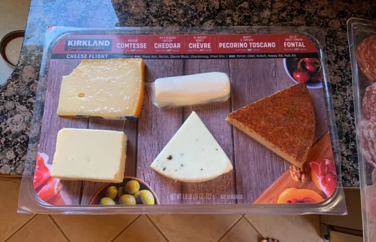 Kirkland Signature Cheese Flight: Comtesse Cheese, English Cheese, Honey Chevre Cheese, Il Tartufo Pecorino Toscano Cheese, Sweet Tomato Fontal Cheese