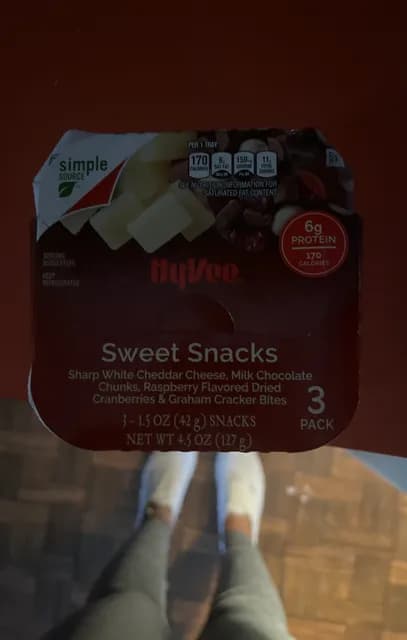 Hy Vee Sweet Snacks Sharp White Cheddar Cheese, Milk Chocolate Chunks, Raspberry Flavored Dried Cranberries & Graham Cracker Bites