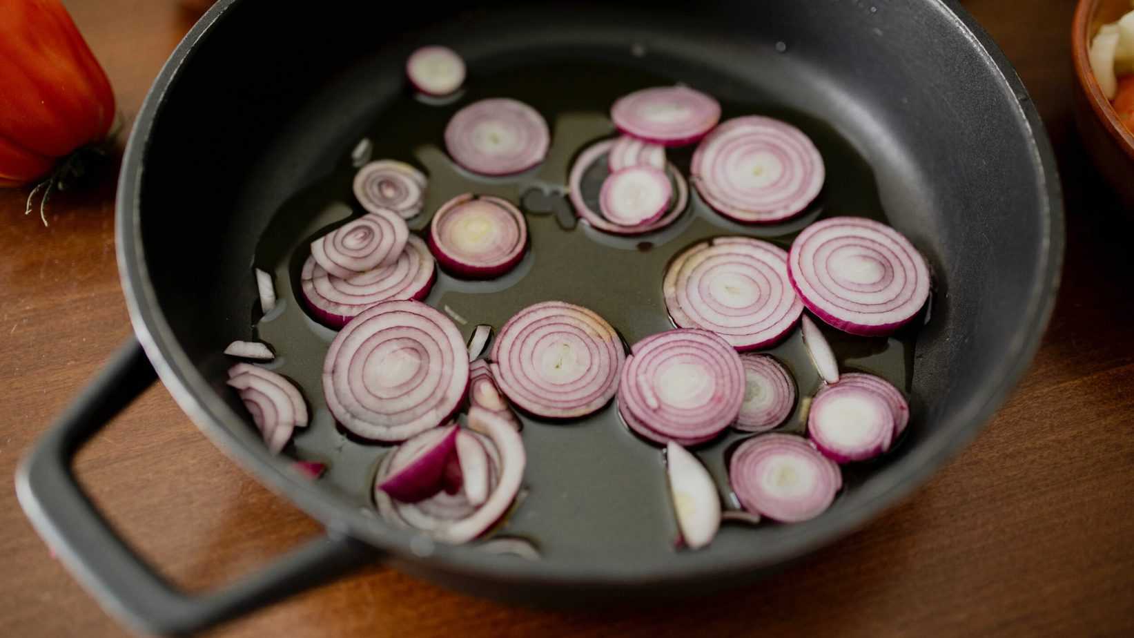 Sliced onions in a pan